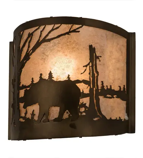The call of the wild comes to light with a majestic Bear roaming around the woodland lake. Beautiful ambient light shines through the Silver Mica lens while the fixture is enhanced with accents and hardware featured in an Antique Copper finish. The ADA-compliant wall sconce can be installed in dining rooms and entryways in residential; hospitality; and commercial spaces. The Bear at Lake Wall Sconce is featured in our American-made; American-designed; handcrafted Wildlife Lighting Collection. This fixture is manufactured in Yorkville; New York. It is UL and cUL listed for dry and damp locations. Upstate New York's adventurous playland; known as the Adirondack Mountains; with its many breathtaking forests; lakes; and rivers; is the spiritual birthplace of Meyda and inspires our rustic-themed mica collections. - alternate view