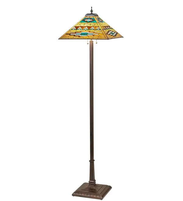 Stunning patterns and colors of Native American blankets and pottery have inspired this Mission-style floor lamp, which features a stained glass shade crafted using the renowned Meyda Tiffany copper foil construction technique and is enhanced with a Mahogany Bronze finished base. The intricately styled shade offers Bark Brown, Sand Beige, and Turquoise glass with arrowhead designs. This floor lamp fits well in living spaces, bedrooms, and foyers in fine homes and restaurants. The Valencia Mission floor Lamp is included in our American-designed, handcrafted Mission Lighting Collection. The pendant is UL and cUL listed for dry locations. Each shade is a unique work of art, featuring color variations derived from the natural ingredients inherent in the glass. Collection: Valencia Finish: Mahogany Bronze Glass: Stained Glass Width: 24.00" Height: 64.00" Length: 17.00" Weight: 22.00 lb Number of Bulbs: 2 Maximum Wattage: 60.00 W Bulb Type: A19 Bulb Base: E26 Material: Zinc/Steel Country of Origin: CHINA Safety Rating: Dry