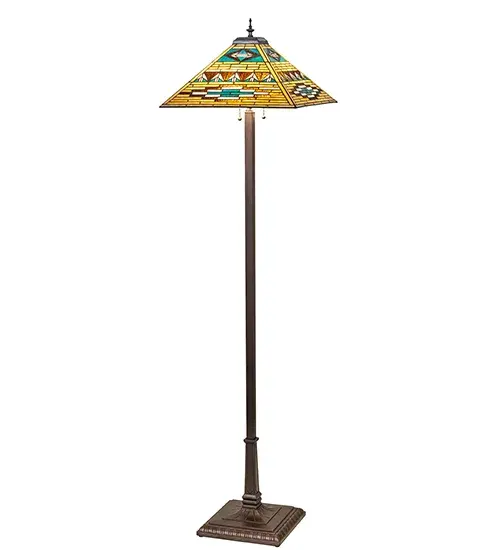Stunning patterns and colors of Native American blankets and pottery have inspired this Mission-style floor lamp, which features a stained glass shade crafted using the renowned Meyda Tiffany copper foil construction technique and is enhanced with a Mahogany Bronze finished base. The intricately styled shade offers Bark Brown, Sand Beige, and Turquoise glass with arrowhead designs. This floor lamp fits well in living spaces, bedrooms, and foyers in fine homes and restaurants. The Valencia Mission floor Lamp is included in our American-designed, handcrafted Mission Lighting Collection. The pendant is UL and cUL listed for dry locations. Each shade is a unique work of art, featuring color variations derived from the natural ingredients inherent in the glass. Collection: Valencia Finish: Mahogany Bronze Glass: Stained Glass Width: 24.00" Height: 64.00" Length: 17.00" Weight: 22.00 lb Number of Bulbs: 2 Maximum Wattage: 60.00 W Bulb Type: A19 Bulb Base: E26 Material: Zinc/Steel Country of Origin: CHINA Safety Rating: Dry - alternate view