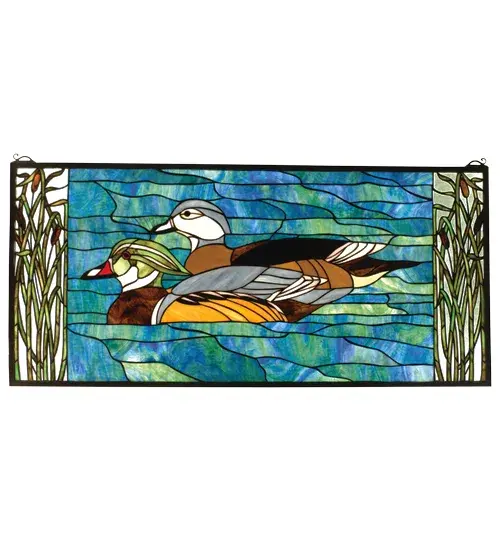 A pair of Brown and Gray Wood Ducks lazily swim in a sparkling Turquoise river. Edged with Marsh Green cattails; this picturesque scene is handcrafted of a beautiful selection of stained art glass. The Meyda Tiffany Original window is framed in solid brass and has brass mounting bracket and chains included.