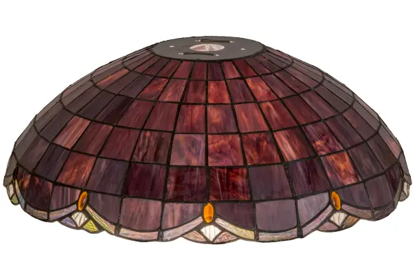 Elan features a Plum/Raspberry art glass shade trimmed in swooping scallops of Amethyst Ripple glass hues; which are accented by sparkling Amber and Clear jewels. The shade is created using the famous Meyda Tiffany copperfoil construction process. It pairs beautifully with a base to create a stunning table or floor lamp and matches beautifully with hardware to build a gorgeous ceiling fixture. The Elan Shade is featured in our American-designed; handcrafted Stained Glass Lighting Collection. Each shade is a unique work of art with color variations based on natural ingredients inherent in the glass.