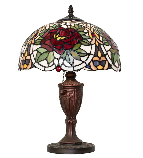 The Renaissance Rose lamp features an art glass shade with Cabernet Red Roses framed in Sunset Green leaves and Ivory scrolls on a Lavender and Plum Bronze lace background. This beautiful art glass shade is complemented with an elegant cast metal base in a Mahogany Bronze finish. The shade is accented with Red jewels and created using the famous Meyda Tiffany copperfoil construction process. Ideal for illuminating tables and desks in homes; banks; and libraries from Boston; Massachusetts; to Des Moines; Iowa; to Seattle; Washington. The Renaissance Rose Table Lamp is included in our American-designed; handcrafted Stained Glass Lighting Collection. UL and cUL listed for dry locations. Each shade is a unique work of art with color variations based on natural ingredients inherent in the glass.