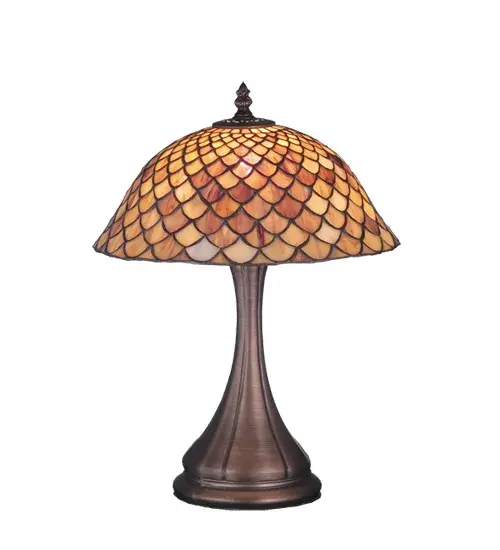 A Louis Comfort Tiffany studio classic fishscale pattern reproduced in variegated Tortoiseshell of Ambers and Burgundy. This handsome stained glass shade is used with a Mahogany Bronze hand finished lamp base. A versatile accent lamp to complement any color or style.