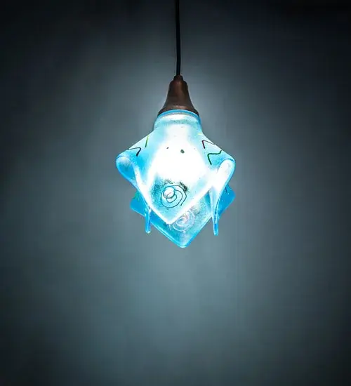 The Electra fusion pendant has a softly draping Handkerchief shade of Azure Blue Art Glass with sizzling streamers of Racy Red and Electric Yellow. The glass shade is kiln fired and allowed to fall into this flowing fabric like shape. Handmade by Meyda Craftsmen the shade with Vintage Copper hardware and round black cord make an electrifying statement.