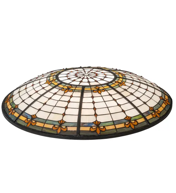 This curvaceous Fleur-de-Lite inverted shade is an elegant design featuring Golden stylized three-petaled irises with Amber colored jewels. A multi-colored band of Blues; Purples; and Greens is featured on a Beige background. This is the shade only. It is intended to pair with hardware as a pendant or flushmount.