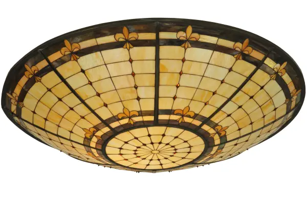 An original Meyda Tiffany design. This curvaceous Fleur-de-Lite art glass shade is an elegant design featuring Golden stylized three-petaled irises with Amber colored jewels. A multi-colored band of Blues; Purples; and Greens is featured on a Beige background. The shade pairs well with hardware to build beautiful ceiling fixtures that can be used to illuminate islands and tables in fine homes and restaurants from Saratoga Springs; New York; to Fishers; Indiana; to Redmond; Washington; The Fleur-de-Lite Shade is featured in our American designed; handcrafted Stained Glass Lighting Collection. Each shade is a unique work of art with color variations based on natural ingredients.
