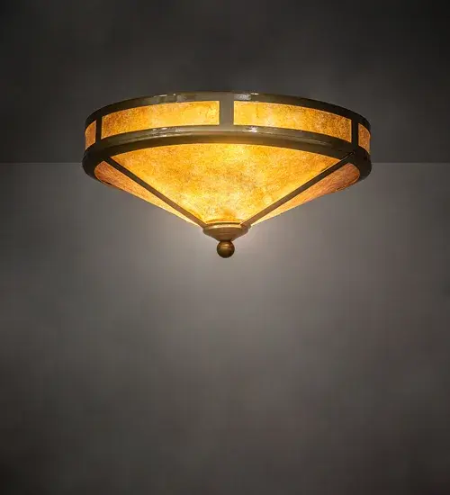 This inverted flush mount features a Golden Amber Mica shade with bordering panels; all held together by a Transparent Brass finished frame; decorative bolt and mount. Handcrafted in the USA.