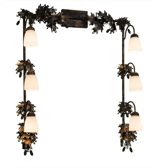 Drawing inspiration from the Mighty Oak; this unique Vanity luminaire is custom designed to outline a mirror in a bath or other rooms. The fixture features delicate steel Oak Leaves and Acorns offered in a Dark Burnished Antique Copper finish.The frame embraces 6 White Art Glass shades to deliver functional down lighting.Custom crafted in the USA; this fixture is available in custom styles; sizes; colors and dimmable energy efficient lamping options such as LED.The fixture is UL and cUL listed for damp and dry locations. - alternate view