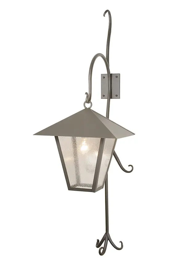 Like a vine growing off a tree; this shepherd's hook suspends a handsome classic outdoor lantern. Clear Seedy glass panels are complemented with a peaked roof and matching hardware hand finished in a stunning Wrought Iron. Handcrafted by Meyda artisans in the Yorkville; New York manufacturing facilities.