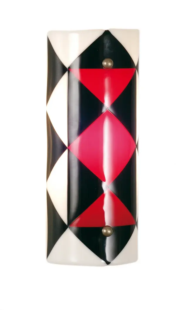 Get your fill of fun and games with the Jester; Metro Fusion ADA compliant wall sconce. Hand cut Black; Red and White glass triangles stack on a slender half tube shade. Fused together in a hot kiln; this fun sconce shade is suspended by Nickel finished powder coated hardware. Designed and created by Meyda artists and craftsmen; for a unique; contemporary fixture.