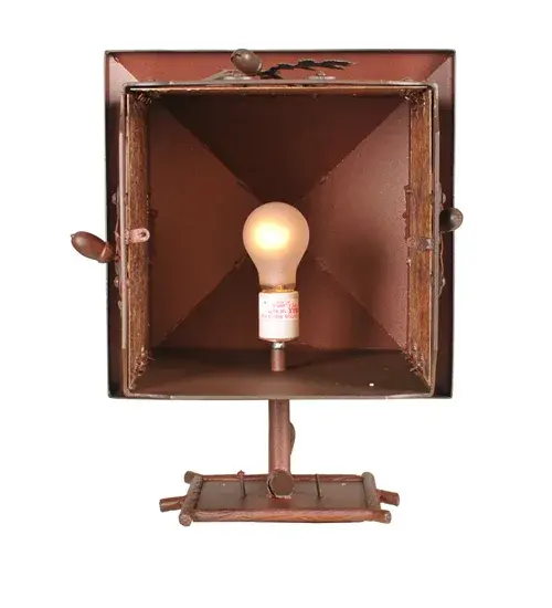 Rustic charm is revealed with this Nature-inspired lighting design as stunning Oak Leaves and Acorns flourish from metal branches that adorn an Amber Mica lens. The hanging wall sconce is complemented by accents; a frame; and hardware in a Rust-on-Wrought Iron finish. The most powerful of all trees; the mighty Oak represents courage and strength. The lantern-style wall fixture is ideal for illuminating hallways and dining areas in residential and hospitality locations. The Oak Leaf & Acorn Curved Arm Wall Sconce is featured in our American-made; American-designed handcrafted Nature Inspired Collection and is manufactured in Yorkville; New York. The fixture is UL and cUL listed for dry and damp locations. - alternate view
