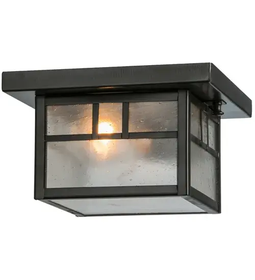 Constructed of Solid Brass, this ceiling fixture features a stunning Craftsman design statement captured with a dramatic Mission-style profile and a Double Bar straight-line design. The Clear Seeded Glass diffuser is enhanced with a frame and hardware in a Craftsman Brown finish. The ceiling fixture is ideal for illuminating corridors and entryways in timber homes, modern farmhouses, and other spaces. The Hyde Park Double Bar Mission Flush Mount is included in our American-made, American-designed, handcrafted Craftsman Signature Series and manufactured in Yorkville, New York. UL and cUL listed for dry, damp, and wet locations. Our Build Your Own Craftsman Signature Series features unlimited combinations of styles. The collection is called Build Your Own because it is fully configurable and customizable from size and design to finish and lens color. Marine-grade, solid brass, or copper raw materials are utilized to ensure items from the Craftsman Signature Series of outdoor and indoor lighting will stand the test of time, as these premium metals are impervious to most types of oxidation. Hand-applied Patina finishes on brass and copper are sealed with a clear varnish and over time, may require gentle maintenance, such as wax, to delay or reverse the natural living finish attributes indicative of this finishing process. Patina finishes on brass and copper provide strong resistance to fading from sun exposure, will not chip or crack, and will not rust like a steel-framed item in the same conditions. Choose from many style options, or send us your concept today! Call today to learn how to use our website's configuration tool to get an instant item number! Collection: Hyde Park Finish: Craftsman Brown Glass: Clear Seeded Glass Width: 11.50" Height: 4.75" Length: 8.00" Weight: 3.00 lb Number of Bulbs: 1 Maximum Wattage: 60.00 W Bulb Type: A19 Bulb Base: E26 Material: Brass Country of Origin: USA Safety Listing: Damp Safety Rating: Wet - alternate view