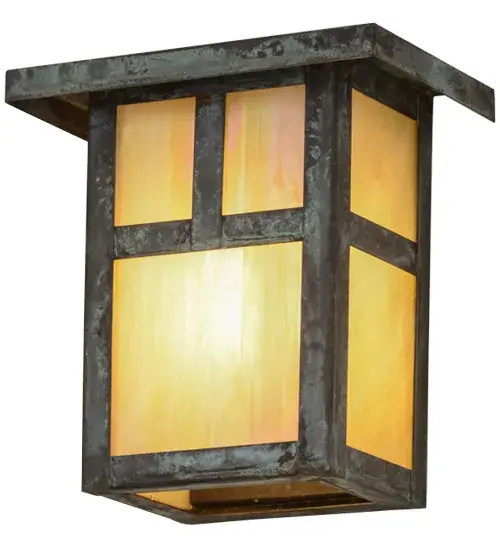 Handcrafted from Solid Brass, this handsome Craftsman Signature fixture is inspired by the Arts and Crafts movement. The striking Mission straight line design is featured in Beige Iridescent art glass, with a frame and hardware finished in Verdigris. The fixture is perfect for both indoor and outdoor applications and handcrafted by Meyda artisans in the Yorkville, NY manufacturing facilities, at the foothills of the Adirondack Mountains. Custom sizes, styles, colors and lamping options are available. Collection: Hyde Park Finish: Verdigris Glass: Beige Iridescent Glass Width: 6.00" Height: 6.00" Length: 4.00" Weight: 2.00 lb Extension from Wall: 4.00" Number of Bulbs: 1 Maximum Wattage: 30.00 W Bulb Type: A15 Bulb Base: Medium Country of Origin: USA Safety Listing: Wet Safety Rating: Wet - alternate view