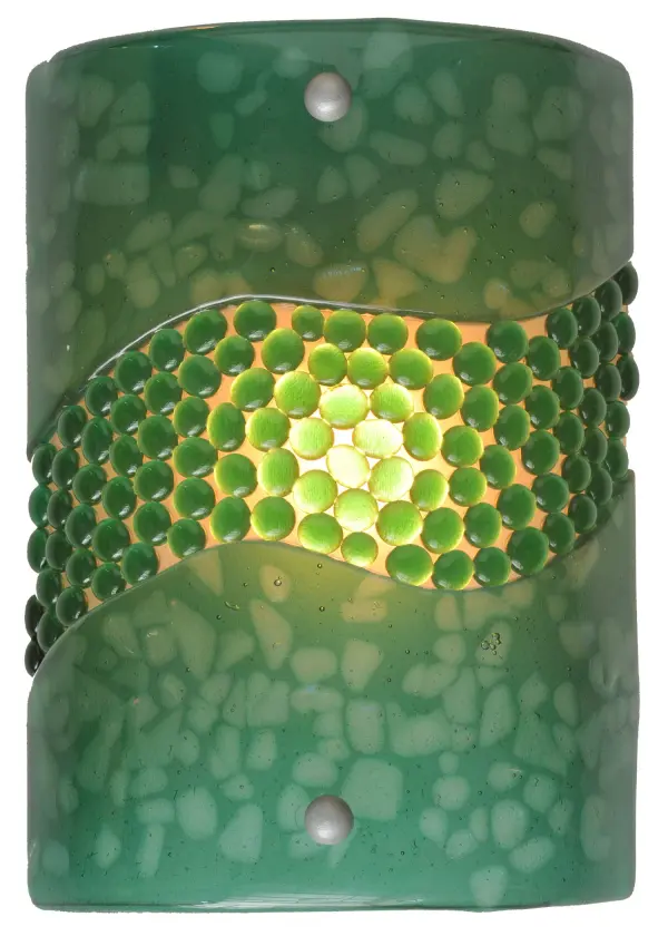 Hot high-fired glass is transformed into a cool abstract lighting design; blending waves of Green Pebbled Glass Jewels on a Green Art Glass background. Striking fused glass defines this extraordinary sconce; which features glass droplets on a solid curved panel. The ADA-compliant wall sconce is ideal for illuminating a wide range of rooms in homes; resorts; hotels; and restaurants. The Metro Fusion Green Pietre Wall Sconce is featured in our American-made; American-designed; handcrafted Modern Lighting Collection; which is manufactured in Yorkville; New York. UL and cUL listed for dry and damp locations. Each shade is a unique work of art with color variations based on natural ingredients inherent in the glass. The Quality Bent Glass division of Meyda Tiffany Lighting is over 100 years in the making. Today; we are still creating timeless masterpieces using tools and methods from the days when we supplied Tiffany Studios. Fused glass colors and metal finishes are customizable; as each fixture is handcrafted to order.