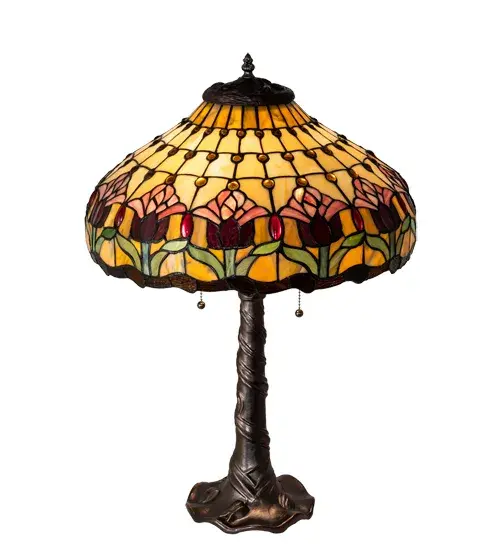 PEARLESCENT BEIGE GLASS PANELS WITH PLUM PINK COLONIAL TULIPS SETTING ATOP SPRING GREEN LEAVES ARE ACCENTED WITH AMETHYST JEWELS AND WAVES OF MAHOGANY GRANITE GLASS. THE MAHOGANY BRONZE FINISHED TABLE LAMP BASE REPEATS THE TULIP PATTERN WITH EMBOSSED WAVES AND SWIRLING LEAVES. Collection: Colonial Tulip Finish: Mahogany Bronze Glass: Ba Br Ja Amber Xag Width: 18.00" Height: 25.50" Length: 18.00" Weight: 10.50 lb Number of Bulbs: 2 Maximum Wattage: 60.00 W Bulb Type: A19 Bulb Base: E26 Material: Zinc Country of Origin: CHINA Safety Listing: Dry Safety Rating: Damp - alternate view