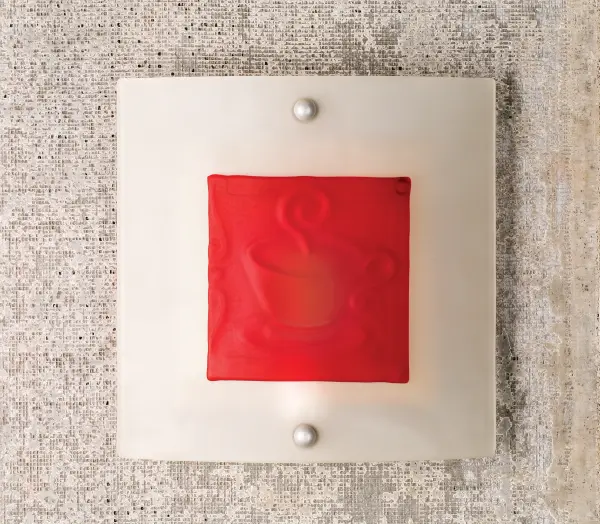Wake up to a steaming hot cup of Caffe Metro Fusion ADA compliant wall sconce. Cast Red hot glass is fused to clear glass and then back etched. This three dimensional sconce shade is suspended by Nickel finished powder coated hardware. Designed and created by Meyda artists and craftsmen for a fun, unique fixture. Collection: Metro Fusion Finish: Nickel Glass: Clear/Red Bas Relief Width: 11.00" Height: 11.00" Length: 3.25" Extension from Wall: 3.25" Number of Bulbs: 1 Maximum Wattage: 60.00 W Bulb Type: T10 Bulb Base: E26 Material: Steel Country of Origin: USA Safety Listing: Dry Safety Rating: Damp