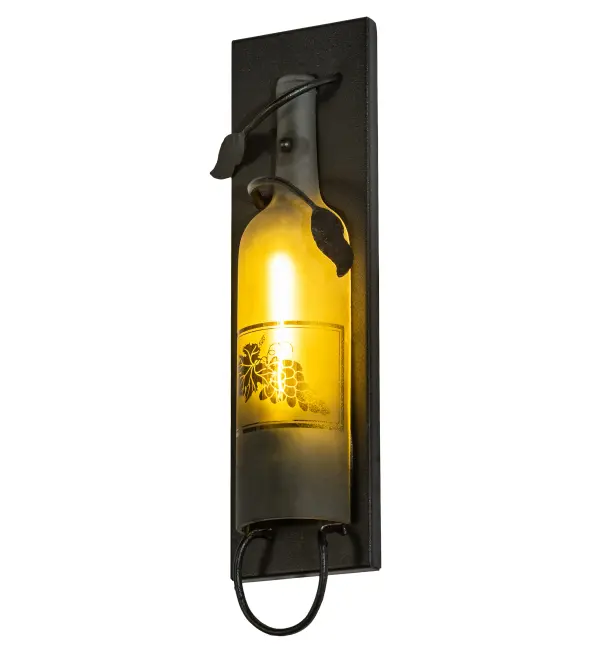 This Meyda Wine Bottle Wall Sconce does so much more than deliver light, it adds personality and pizzazz. A Green half-wine bottle features a hand-etched grape design and is embraced with vine-like accents and hardware featured in a Textured Black finish. Perfect for hallways, dining areas, and other spaces in homes, restaurants, hotels, pubs, nightclubs, wineries, and retailers. This wall luminaire will be appreciated for its fine detail and charm by connoisseurs from Washingtonville, New York, to Bluemont, Virginia, to Napa Valley, California. This rich-looking Tuscan Vineyard Wine Bottle Wall Sconce is included in our American-made, American-designed, handcrafted Wine Bottle Lighting Collection. The fixture is manufactured in Yorkville, New York. UL and cUL listed for dry and damp locations. Take your finest bottle of wine, and Meyda will transform it into an everlasting personalized fixture of light. Contact us for more information on custom wine bottle lighting fixtures and lamps. You can also create custom lighting with beer bottles, mason jars, milk bottles, and other glass containers and vessels by contacting us! Collection: Tuscan Vineyard Finish: Textured Black Glass: Frosted Green Notes: Custom Crafted In Yorkville, New York Please Allow 50 Days Width: 5.00" Height: 15.50" Length: 2.50" Weight: 2.00 lb Extension from Wall: 2.50" Number of Bulbs: 1 Maximum Wattage: 40.00 W Bulb Type: T6.5 Bulb Base: E17 Material: Steel Country of Origin: USA Safety Listing: Dry Safety Rating: Damp