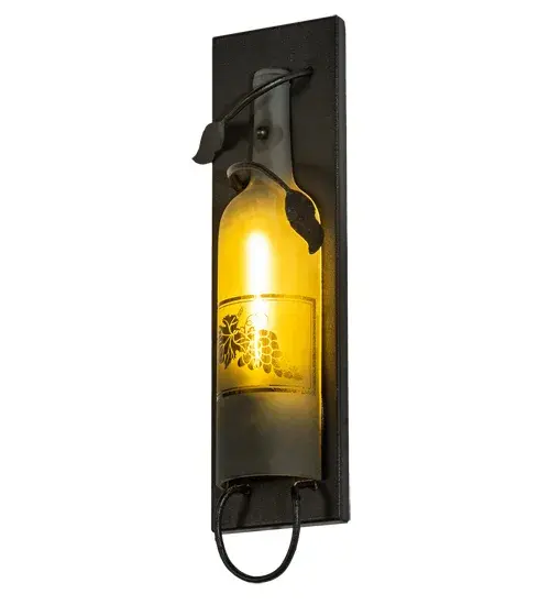 This Meyda Wine Bottle Wall Sconce does so much more than deliver light, it adds personality and pizzazz. A Green half-wine bottle features a hand-etched grape design and is embraced with vine-like accents and hardware featured in a Textured Black finish. Perfect for hallways, dining areas, and other spaces in homes, restaurants, hotels, pubs, nightclubs, wineries, and retailers. This wall luminaire will be appreciated for its fine detail and charm by connoisseurs from Washingtonville, New York, to Bluemont, Virginia, to Napa Valley, California. This rich-looking Tuscan Vineyard Wine Bottle Wall Sconce is included in our American-made, American-designed, handcrafted Wine Bottle Lighting Collection. The fixture is manufactured in Yorkville, New York. UL and cUL listed for dry and damp locations. Take your finest bottle of wine, and Meyda will transform it into an everlasting personalized fixture of light. Contact us for more information on custom wine bottle lighting fixtures and lamps. You can also create custom lighting with beer bottles, mason jars, milk bottles, and other glass containers and vessels by contacting us! Collection: Tuscan Vineyard Finish: Textured Black Glass: Frosted Green Notes: Custom Crafted In Yorkville, New York Please Allow 50 Days Width: 5.00" Height: 15.50" Length: 2.50" Weight: 2.00 lb Extension from Wall: 2.50" Number of Bulbs: 1 Maximum Wattage: 40.00 W Bulb Type: T6.5 Bulb Base: E17 Material: Steel Country of Origin: USA Safety Listing: Dry Safety Rating: Damp - alternate view