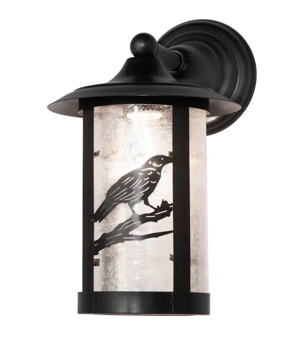 Handcrafted from Solid Brass with alluring rustic beauty. This stunning Craftsman Signature lantern features a lovely Raven on a Clear Seeded Glass diffuser that is enhanced with a Craftsman Brown finish. Install this wall sconce to illuminate the exterior of timber homes; modern farmhouses; and other spaces. The Fulton Raven Solid Mount Wall Sconce is featured in our American-made; American-designed; handcrafted Craftsman Signature Series; which is manufactured in Yorkville; New York. UL and cUL listed for dry; damp; and wet locations. Our Build Your Own Craftsman Signature Series features unlimited combinations of styles. The collection is called Build Your Own because it is fully configurable and customizable from size and design to finish and lens color. Marine-grade; solid brass; or copper raw materials are utilized to ensure items from the Craftsman Signature Series of outdoor and indoor lighting will stand the test of time; as these premium metals are impervious to most types of oxidation. Hand-applied Patina finishes on brass and copper are sealed with a clear varnish and; over time; may require gentle maintenance; such as wax; to delay or reverse the natural living finish attributes indicative of this finishing process. Patina finishes on brass and copper provide strong resistance to fading from sun exposure; will not chip or crack; and will not rust like a steel-framed item in the same conditions. Mica is less durable in outdoor locations but may be appropriate for mildly exposed areas. Choose from many style options; or send us your concept today! Call today to learn how to use the configuration tool available on our website for an instant item number!
