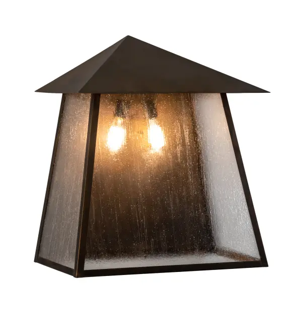 Custom-made from Solid Brass; this Stillwater Wall Sconce is constructed for interior and exterior applications. A stunning Craftsman design statement is captured with a dramatic Mission-style profile. The fixture can be mounted to columns; posts; and decks while providing beautiful ambient lighting in timber homes; modern farmhouses; and other spaces from Traverse City; Michigan; to Lake Tahoe; Nevada; to Lake Geneva; Wisconsin. The Clear Seeded Glass diffuser reveals two Edison-styled lamps and is enhanced with a frame and hardware featured in a Vintage Brass finish. The Stillwater Prime Wall Sconce is included in our American-made; American-designed; handcrafted Craftsman Signature Series and manufactured in Yorkville; New York. UL and cUL listed for dry; damp; and wet locations. Our Build Your Own Craftsman Signature Series features unlimited combinations of styles; functions; sizes; and finishes. Options include lanterns; pier and post mounts; and deck lights crafted of marine-grade materials like brass and copper with timeless living finishes offered to endure harsh climates.