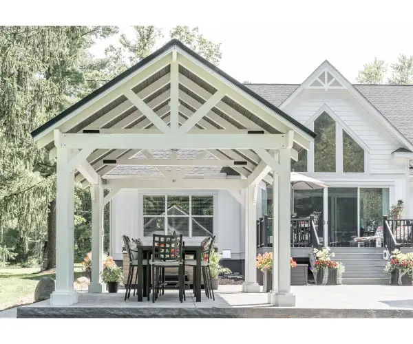 Immerse yourself in the epitome of outdoor elegance with Berlin Gardens' Breckenridge Pavilion. A harmonious blend of timeless design and meticulous craftsmanship, this pavilion transforms your outdoor space into a captivating retreat, providing the perfect setting for gatherings and moments of tranquil luxury. Standard Model Includes: • 8" X 8" posts • Straight beams • Straight or arched braces • Notched post and beam joint • Gable roof design • 12" overhang - alternate view
