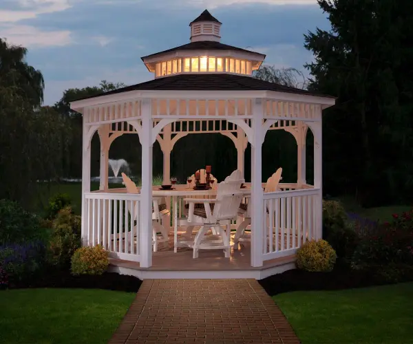 Discover the timeless charm of outdoor living with Berlin Gardens' Vinyl Octagon Gazebo, an exquisite blend of classic design and durable craftsmanship. Crafted with meticulous attention to detail, this gazebo transforms your outdoor space into a captivating retreat, offering both elegance and shelter for moments of relaxation and entertaining. Standard Model Includes: • White vinyl exterior • Regular roof • American style railing • Metal or asphalt roofing • Cupola