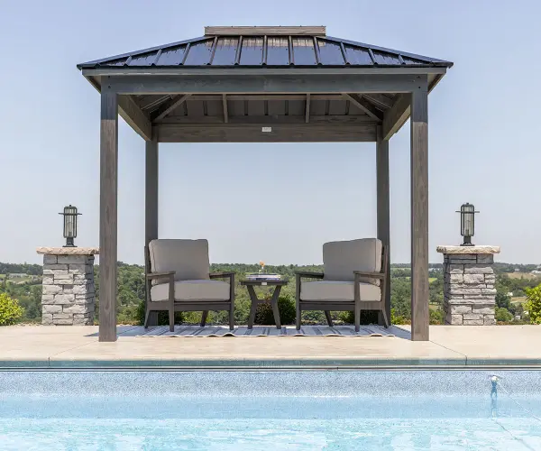 Dimensions: • 9' x 9' outside to outside of posts Features: • Moon roof - protects you from the elements but allows you to look up at the sky and still enjoy being outside • Easy to assemble Options: • Privacy walls • Hinged awning • Fixed Louvers • Adjustable louvers • Bar • Bar with a base panel Available Colors: • Cedartone, Mocha, and Stormcloud