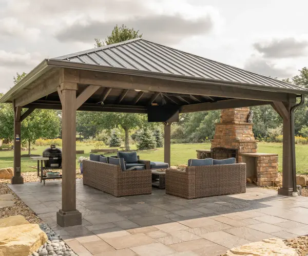 Introducing the Cascade Pavilion – an architectural masterpiece that cascades elegance and functionality into your outdoor oasis. With its captivating design and meticulous craftsmanship, this pavilion creates a stunning focal point, providing a picturesque haven for gatherings and relaxation amidst the beauty of nature. Standard Model Includes: • 8" X 8" posts • Straight beams • Straight or arched braces • Notched post and beam joint • Hip roof design • 11" overhang