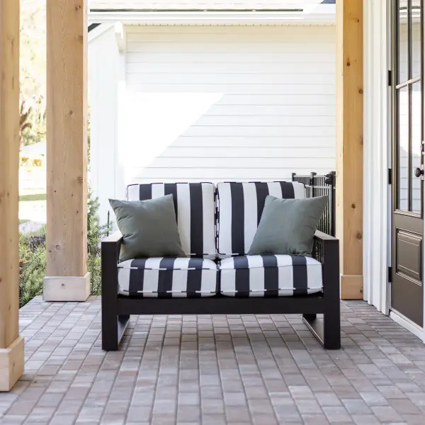 Dimensions: 51½"W x 32"D x 32¾"H Arm Height: 23⅞"H Features: • Marine Grade Poly (MGP) furniture is crafted from molded polyethylene, making it resistant to the elements, including UV rays, moisture, and extreme temperatures • It is designed to withstand elements such as sun, rain, and snow • It doesn’t splinter, crack, or fade over time. • MGP furniture requires minimal maintenance. It is easy to clean and doesn’t require staining, sealing, or painting • MGP’s allows for a thinner profile which allows for sleeker furniture designs • Fade resistant colors on the cushions Item Code: NHL5233 - alternate view