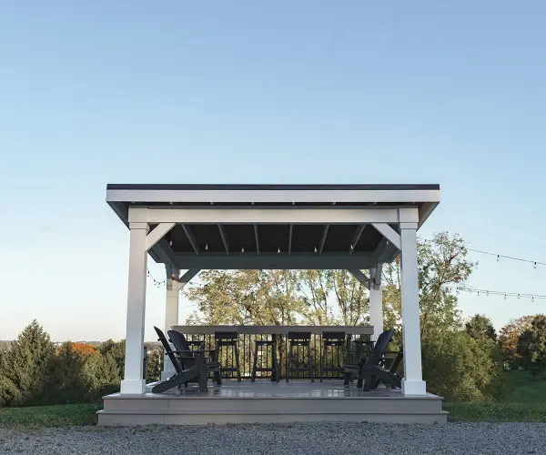 The Siena Pavilion – where rustic charm meets sophisticated design in perfect harmony. Immerse yourself in the allure of the great outdoors with this thoughtfully crafted pavilion, creating a picturesque haven for gatherings and moments of tranquility in your outdoor space. Standard Model Includes: • Pressure-treated wood wrapped with cellular PVC • Paintable • 1/12 pitch roof • 8×8 posts • Straight beams • Straight braces • Slant roof design • Notched post and beam joint