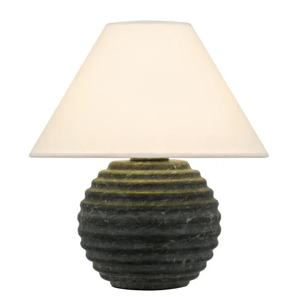 Grounded in sculptural elegance, the Alessandro table lamp blends strength and softness with quiet confidence. Its ribbed matte black base, crafted from real marble, feels timeless and tactile—like a weathered stone shaped by nature. Topped with a classic fabric shade that casts a warm, inviting glow, Alessandro creates a beautiful contrast between solid form and soft light. The effect is one of intimacy and stillness, perfect for bedside tables, reading nooks, or quiet corners. Understated yet refined, Alessandro is a love letter to form, balance, and atmosphere.