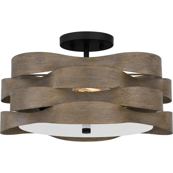 Sculptural, modern art meets elements of rustic styling in this bold, new collection. Available as either a semi-flush mount or pendant light, Appleton features a layered metal shade and a classic matte black finish. The metal shade has soft alternating curves and a slightly distressed wood-tone finish, giving it a unique and artful vibe.