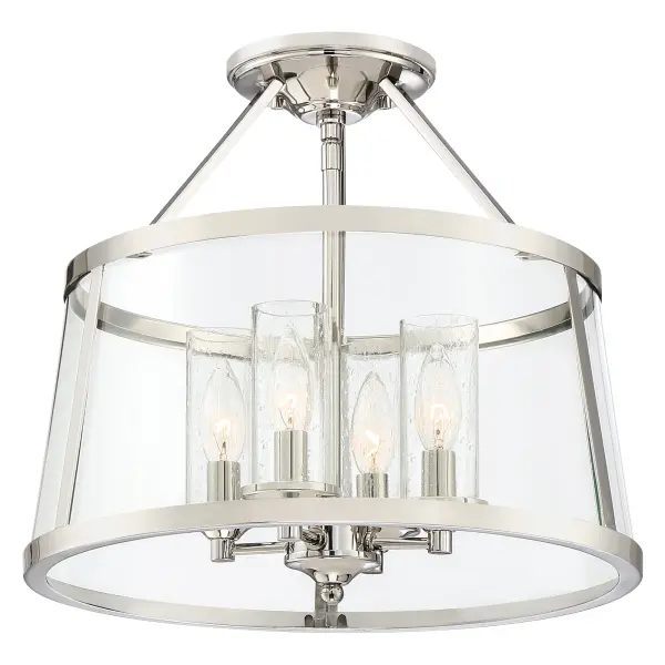 The Barlow's transitional design adds simple sophistication to any space. The gleaming polished nickel frame highlights the beautiful drum silhouette of the outer shade, which features clear bent glass panels. Within the drum, seedy glass surrounds each individual candle, creating a layered look that's sure to please.