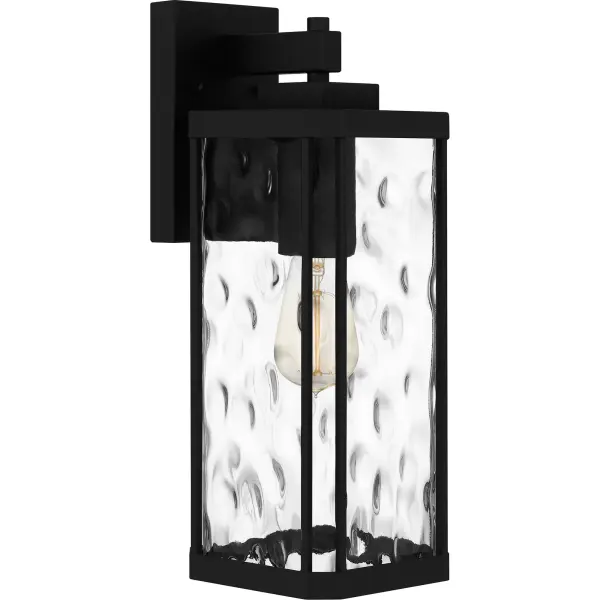 Clear hammered glass adds major visual intrigue in the Balchier lantern collection. The coastal-inspired frame is crafted from steel and finished in a classic matte black, creating a look that is both on-trend and durable. Install Balchier by itself or flank a front door with a lantern on either side to create instant, welcoming illumination for your guests. Balchier is also available as a post or hanging lantern.