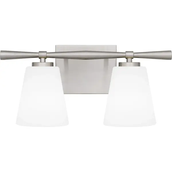 With geometric lines and a slim silhouette, Brindley bath lights draw inspiration from mid-century design. Opal etched glass shades soften the light, creating a warm spa-like glow. Brindley is available in multiple size options and your choice of brushed nickel or aged brass - choose the finish that best suits your distinctive style. Collection: Brindley Rooms: Bathroom Finish: Brushed Nickel Glass: Opal Etched Glass Width: 15.75" Height: 7.25" Length: 5.75" Weight: 2.95 lb Extension from Wall: 5.75" Wire: 6" Canopy: 6.000"x4.750" Number of Bulbs: 2 Maximum Wattage: 100.00 W Bulb Type: A19 Bulb Base: Medium Dimmable Voltage: 120.00 V Material: Steel Safety Listing: ETL Spec Sheet Instructions