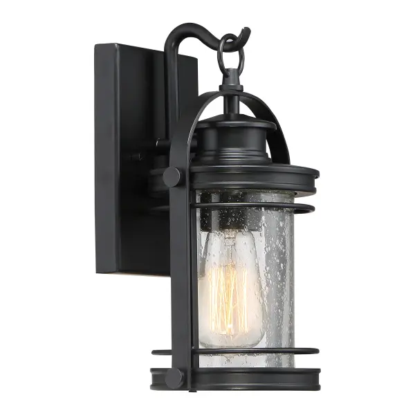 The Booker Outdoor Collection is a fresh and charming style.  The design features a curved arm on the backplate “holding” the lantern and the finish is an inky Mystic Black.  All of the details from the knobs, round trim and light seedy glass come together to create a series perfect for a home’s exterior.