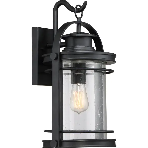 The Booker Outdoor Collection is a fresh and charming style.  The design features a curved arm on the backplate “holding” the lantern and the finish is an inky Mystic Black.  All of the details from the knobs, round trim and light seedy glass come together to create a series perfect for a home’s exterior.