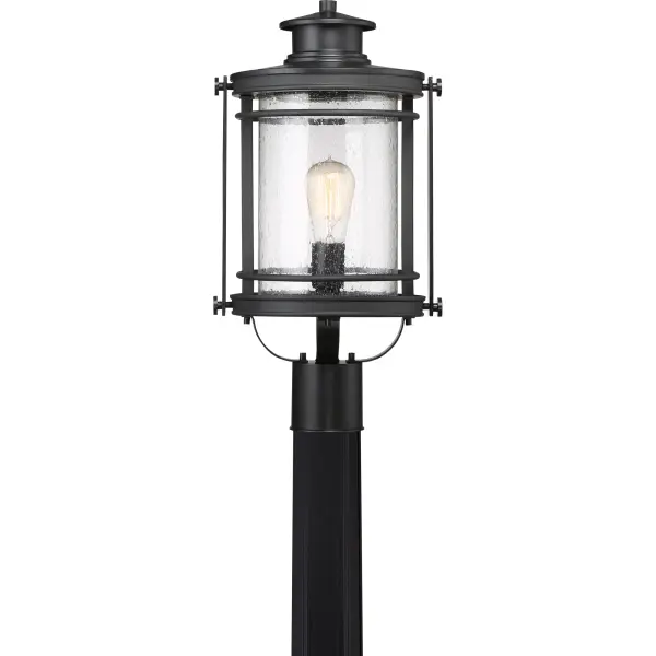 The Booker Outdoor Collection is a fresh and charming style.  The design features a curved arm on the backplate “holding” the lantern and the finish is an inky Mystic Black.  All of the details from the knobs, round trim and light seedy glass come together to create a series perfect for a home’s exterior.