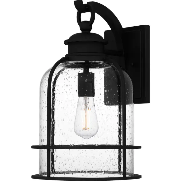 Bowles outdoor lanterns give a nod to both industrial and coastal design. The stately silhouette features clean lines, intricate hook detailing, and exposed bulb sockets - all in a classic Earth Black finish. Clear seedy glass completes the look, offering visual intrigue and style. Bowles is available as a hanging lantern or in multiple sizes of wall light, perfect for illuminating a front porch or landscape.