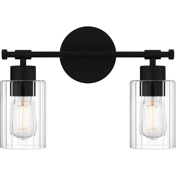 Clear ribbed glass shades create a sense of tranquility in the Caputo bath light collection. This versatile, modern industrial style design is accentuated by clean lines and finished in matte black for timeless appeal. Configure Caputo with shades facing up or down depending on your vanity lighting needs.