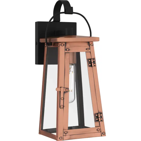 Drawing style inspiration from historical gas lanterns, Carolina adds romantic charm to any home's exterior. The traditional silhouette features an aged copper finish, embellished with hand riveted accents and clear glass panels to maximize the light output. Choose from wall lantern, hanging lantern, or post lantern in this versatile collection.