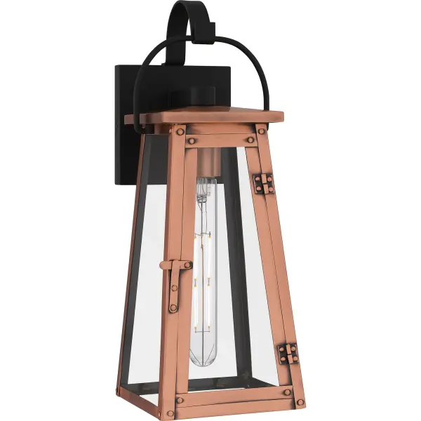 Drawing style inspiration from historical gas lanterns, Carolina adds romantic charm to any home's exterior. The traditional silhouette features an aged copper finish, embellished with hand riveted accents and clear glass panels to maximize the light output. Choose from wall lantern, hanging lantern, or post lantern in this versatile collection.