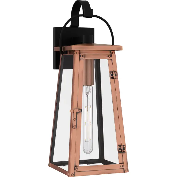 Drawing style inspiration from historical gas lanterns, Carolina adds romantic charm to any home's exterior. The traditional silhouette features an aged copper finish, embellished with hand riveted accents and clear glass panels to maximize the light output. Choose from wall lantern, hanging lantern, or post lantern in this versatile collection.