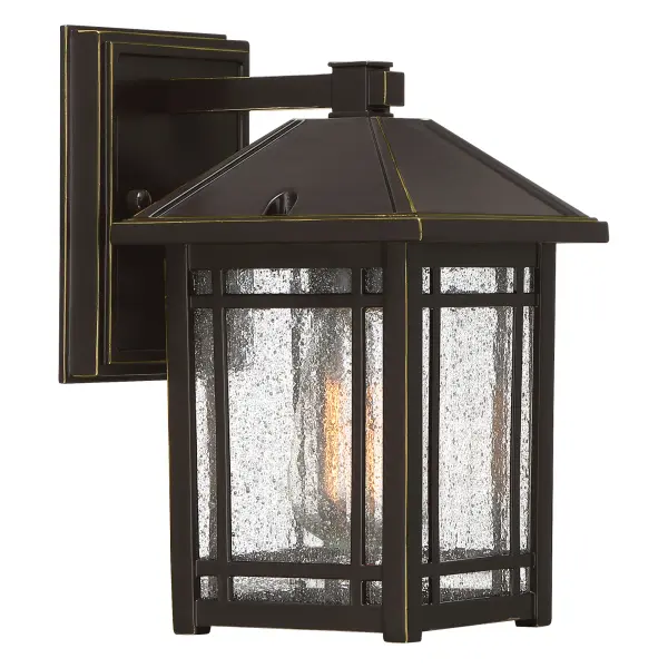 From a rustic lodge to a craftsman-style cottage, the Cedar Point collection is versatile styling at its finest. The seedy glass panels subtly obscure the light source while providing visual interest. The frame is accented with slender trim and lattice detailing that beautifully frames the lantern’s soft glow. A rich Palladian bronze finish completes the look.