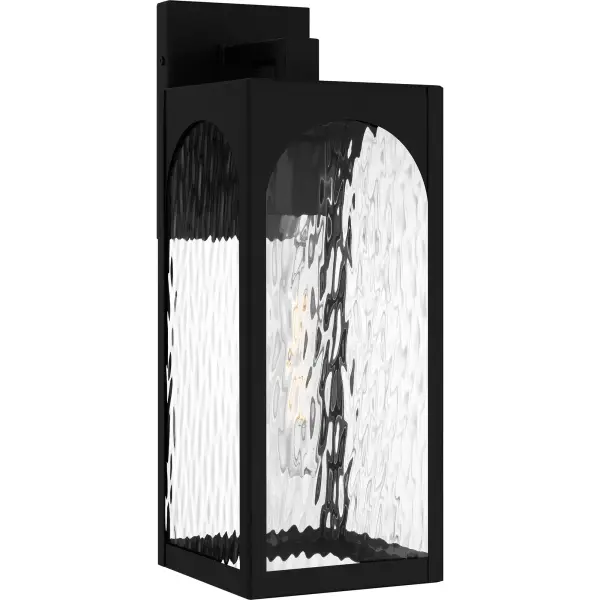 The Dallington outdoor wall lantern is a perfect match for transitional-inspired exteriors.  Its clean lines and beautiful arch design add a touch of elegance and sophistication to any entryway or patio. The sturdy matte black frame ensures durability, while the clear water glass provides a classic look.  Dallington is designed to withstand the elements in style, making it a great choice for year-round use.