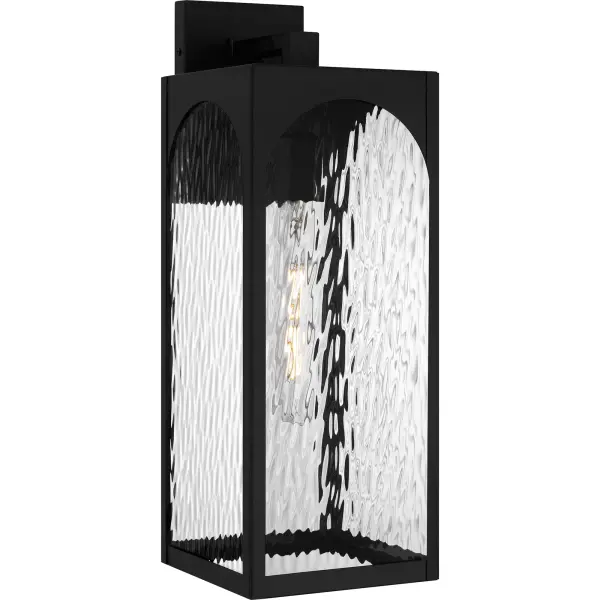 The Dallington outdoor wall lantern is a perfect match for transitional-inspired exteriors.  Its clean lines and beautiful arch design add a touch of elegance and sophistication to any entryway or patio. The sturdy matte black frame ensures durability, while the clear water glass provides a classic look.  Dallington is designed to withstand the elements in style, making it a great choice for year-round use.