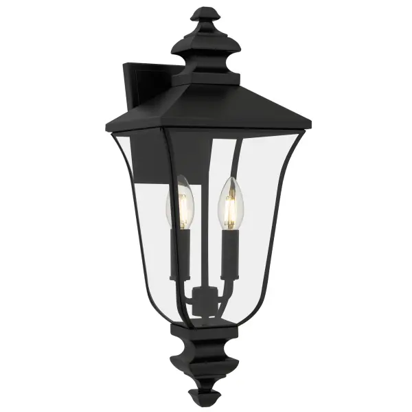 Gracefully bridging the charm of old-world elegance with modern sophistication, Farley Outdoor Lanterns cast a warm, inviting glow that turns every evening into a moment worth savoring. With a matte black finish and crystal-clear glass panels, each lantern showcases delicate details and a silhouette reminiscent of historic carriage lanterns — perfect for creating a nostalgic ambiance on your porch, patio, or garden path. Customize your look with included candle sets in matte black or white for a charming, candlelit ambiance.