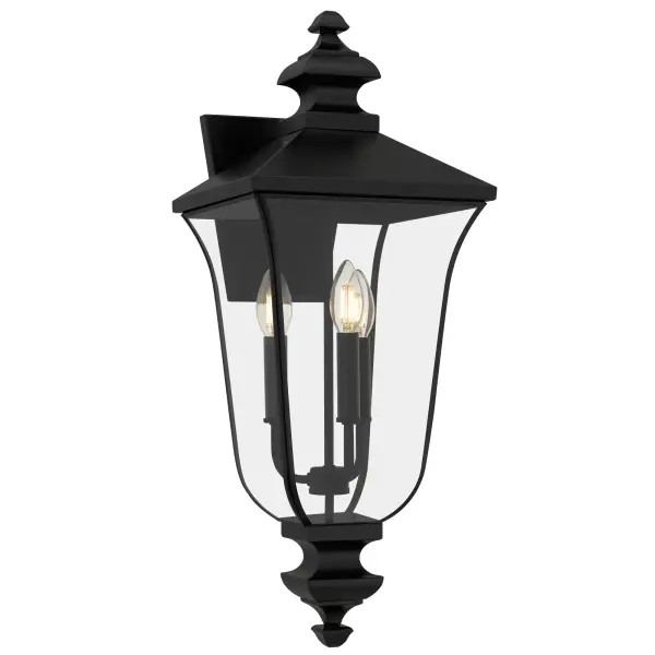 Gracefully bridging the charm of old-world elegance with modern sophistication, Farley Outdoor Lanterns cast a warm, inviting glow that turns every evening into a moment worth savoring. With a matte black finish and crystal-clear glass panels, each lantern showcases delicate details and a silhouette reminiscent of historic carriage lanterns — perfect for creating a nostalgic ambiance on your porch, patio, or garden path. Customize your look with included candle sets in matte black or white for a charming, candlelit ambiance.