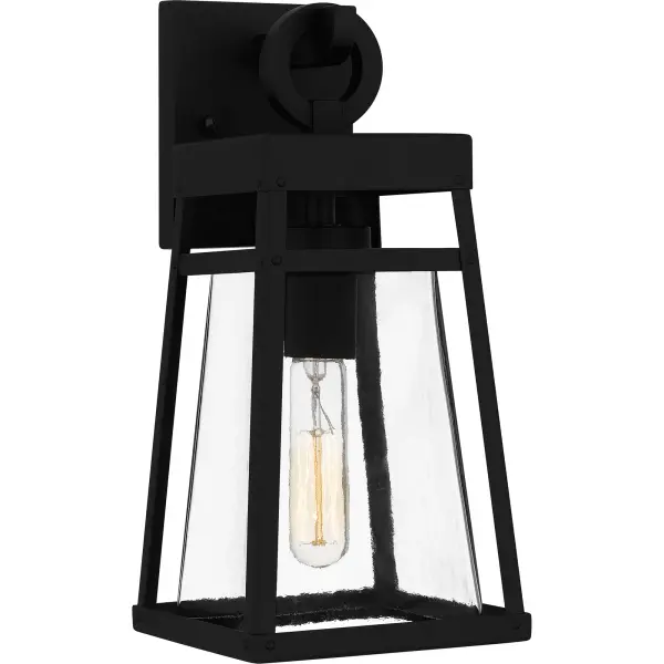 Godfrey is a modern industrial wall lantern designed for sleek exteriors. Its gently tapered frame and matte black finish add to the collection's versatility, while a clear rain glass shade showcases the natural beauty of the light. With subtle industrial details, Godfrey is the perfect style choice next to a front door or as a porch light. As part of our Coastal Armour collection, this product is durable, marine grade, and comes with a 5-year limited warranty.