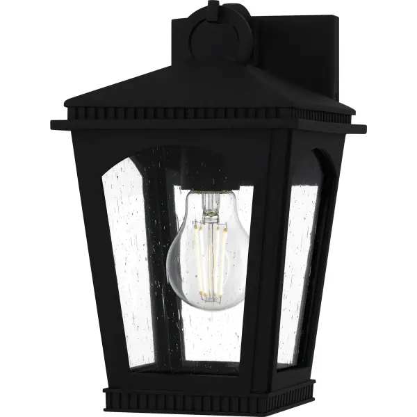 The Huck outdoor lantern collection offers a traditional design with a twist, perfect for sleek exteriors. The tapered frame is finished in a sophisticated earth black finish and features unique ribbed detailing along the top that adds visual interest. Clear seedy glass panels complete the look and allow the natural beauty of the bulb to shine through,  providing a warm and inviting glow. Huck is available in a complete collection, allowing you to create a cohesive look for your entire outdoor space.